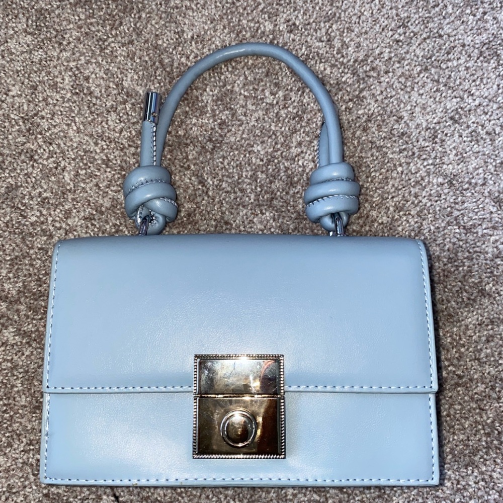 Never used. Can be used as crossbody or Handbag